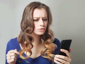 woman looking at her phone