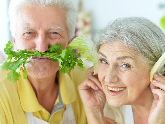 senior couple with veggies