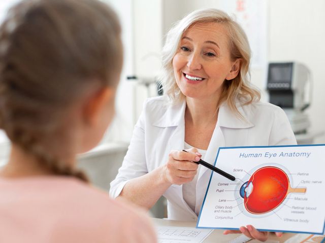 eye doctor talking to patient