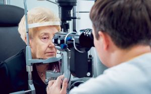 Senior woman checking her vision with ophthalmologist