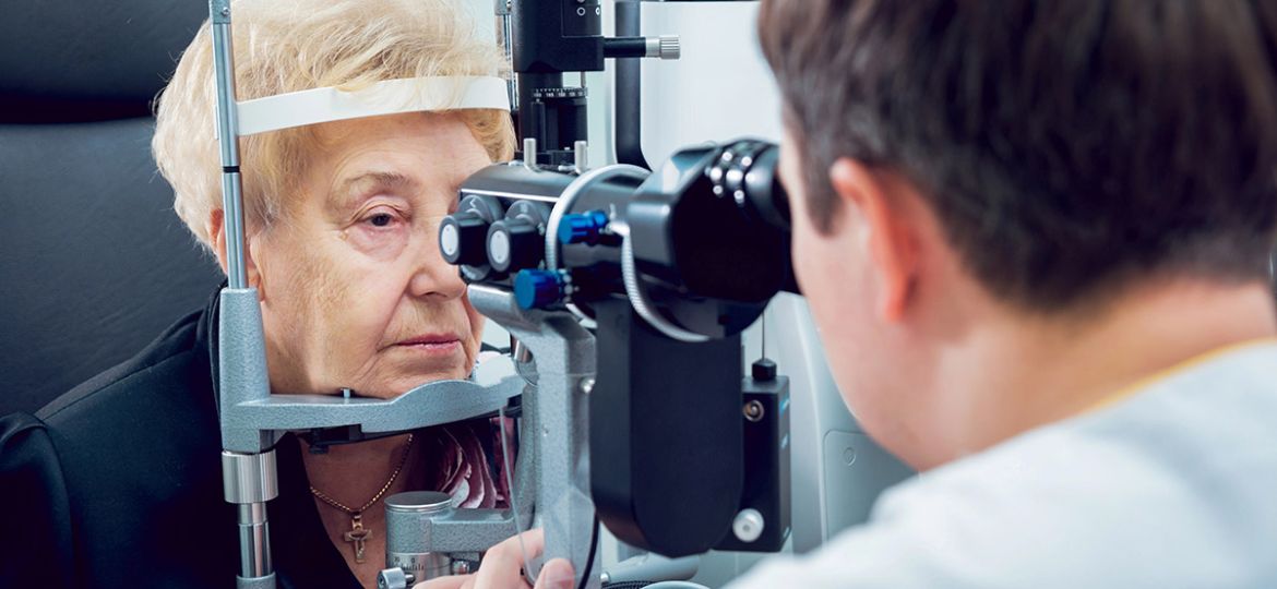 Senior woman checking her vision with ophthalmologist