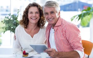 happy couple smiling at a restaurant