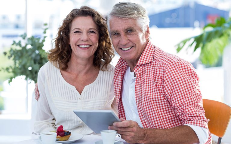 happy couple smiling at a restaurant