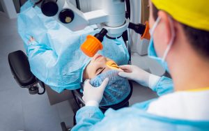 woman checking her vision with ophthalmologist