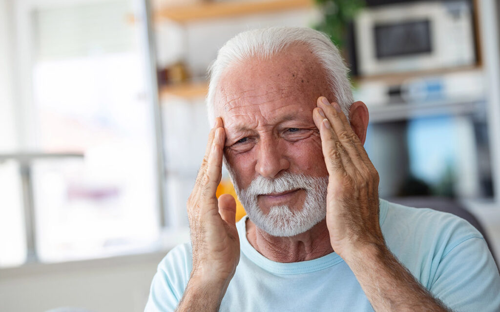 senior man with eye problems