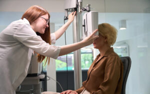 doctor checking her patient eyes