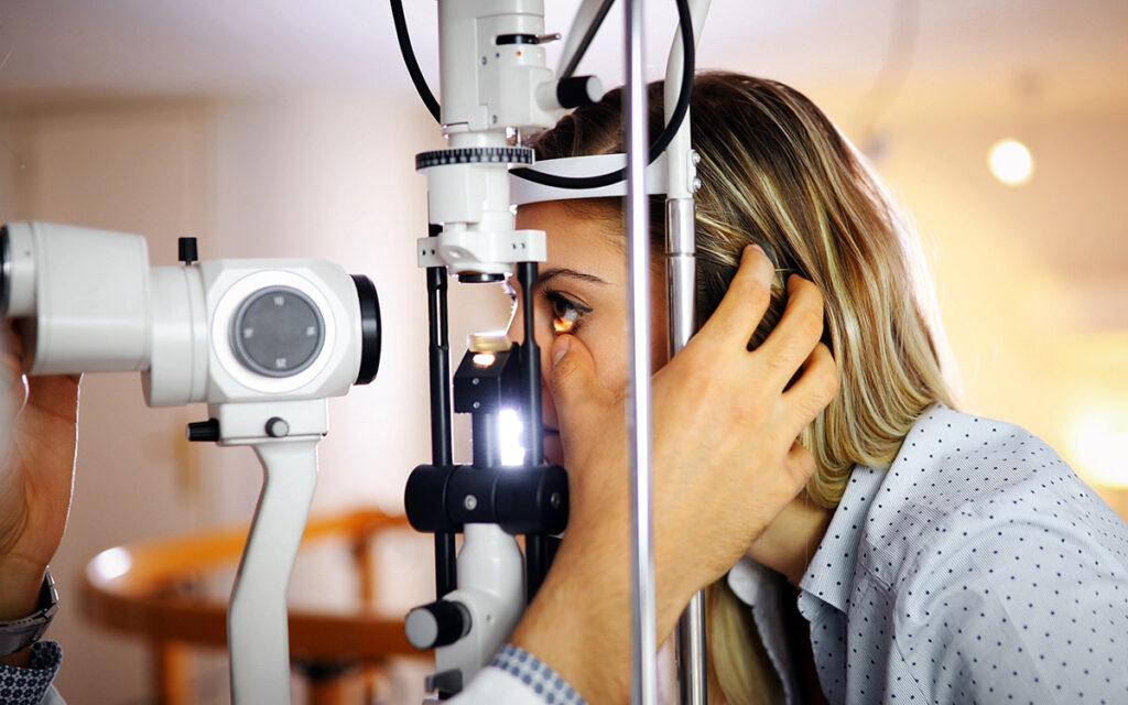 doctor examining patient's eye