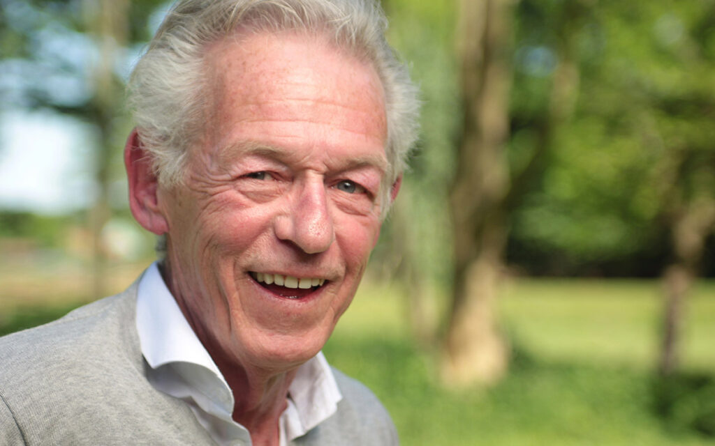 senior man smiling in the park