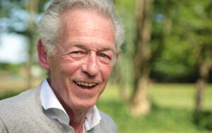 senior man smiling in the park