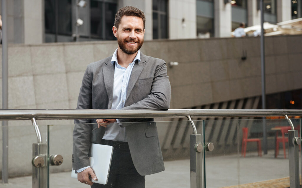 man in his 40s leaving his office