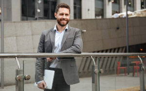 man in his 40s leaving his office